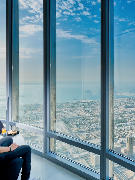 View from Burj Khalifa At The Top overlooking Dubai skyline and The Palm.