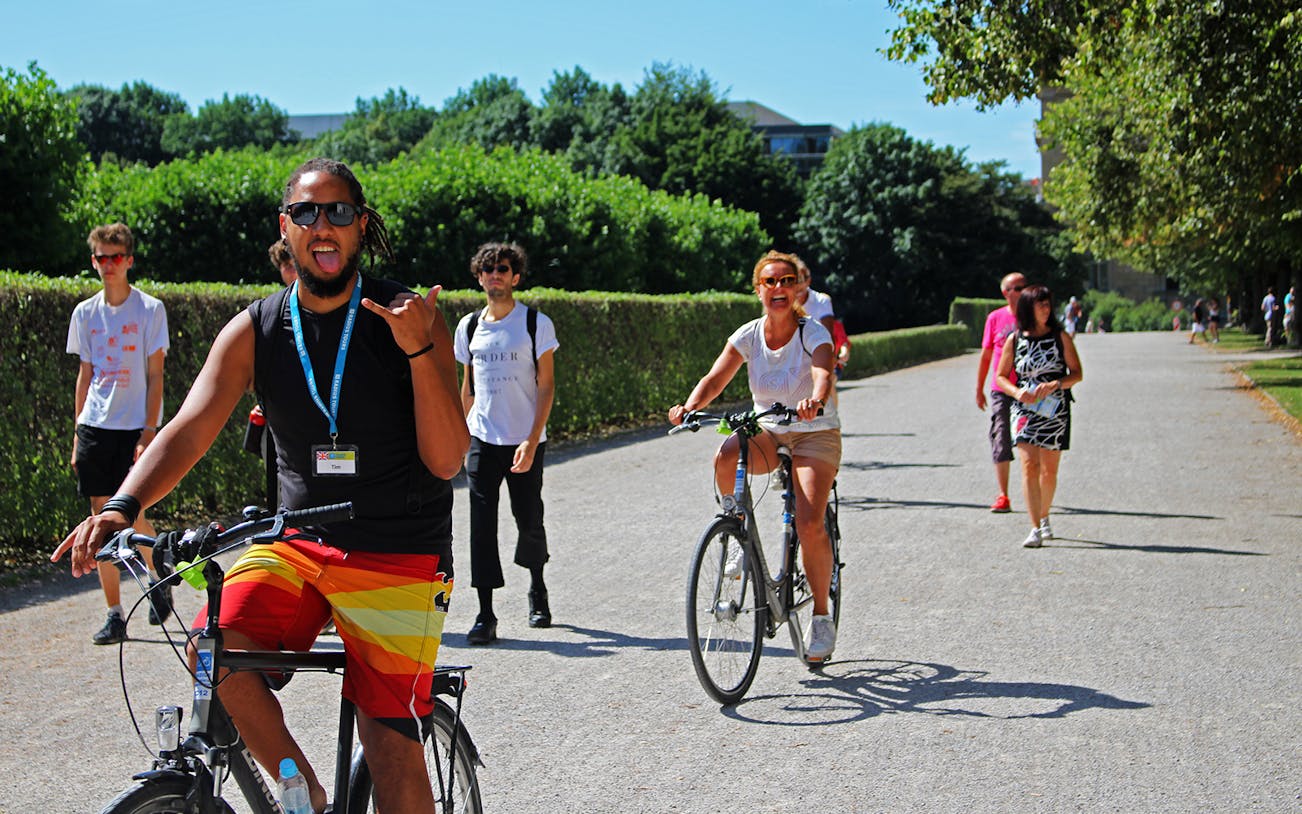 Cyclists enjoying a sunny day on a Munich bike tour.