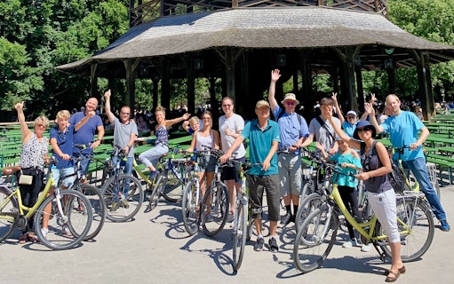 Group of cyclists at the Chinese Tower in Munich's English Garden during a bike tour.