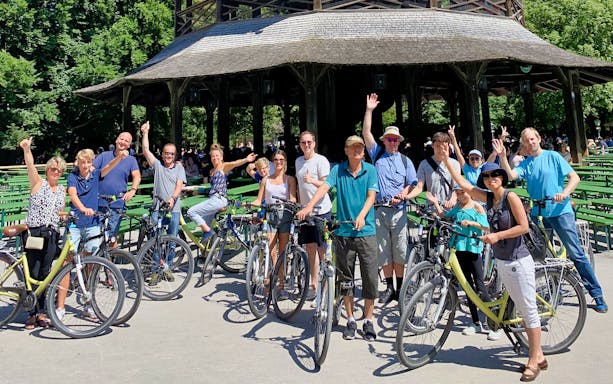 Group of cyclists at the Chinese Tower in Munich's English Garden during a bike tour.