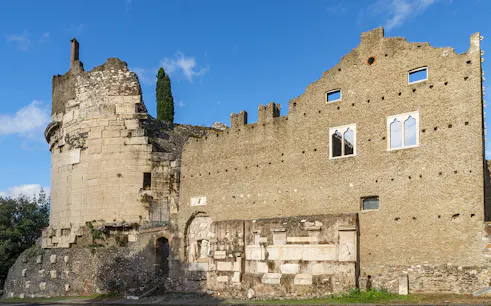 Mausoleum of Augustus ancient stone structure in Rome under blue sky.
