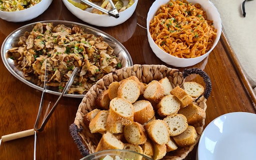 Assorted Greek dishes served on Athens Riviera night cruise.