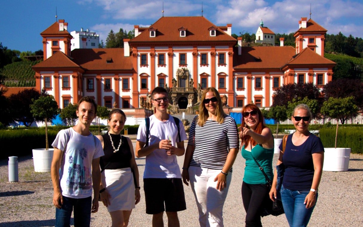 Group of tourists in front of Troja Palace, Prague, during a river cruise to the zoo.