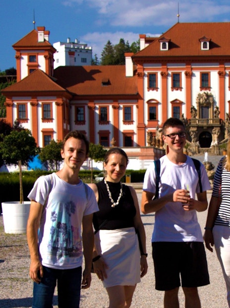 Group of tourists in front of Troja Palace, Prague, during a river cruise to the zoo.