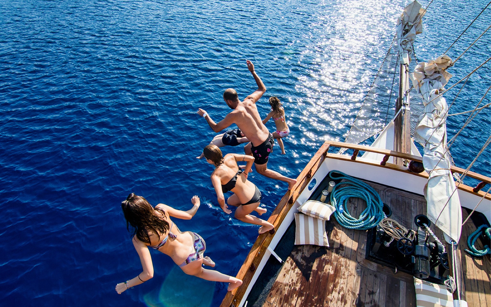 Santorini volcanic islands at sunset during a cruise with optional dinner.