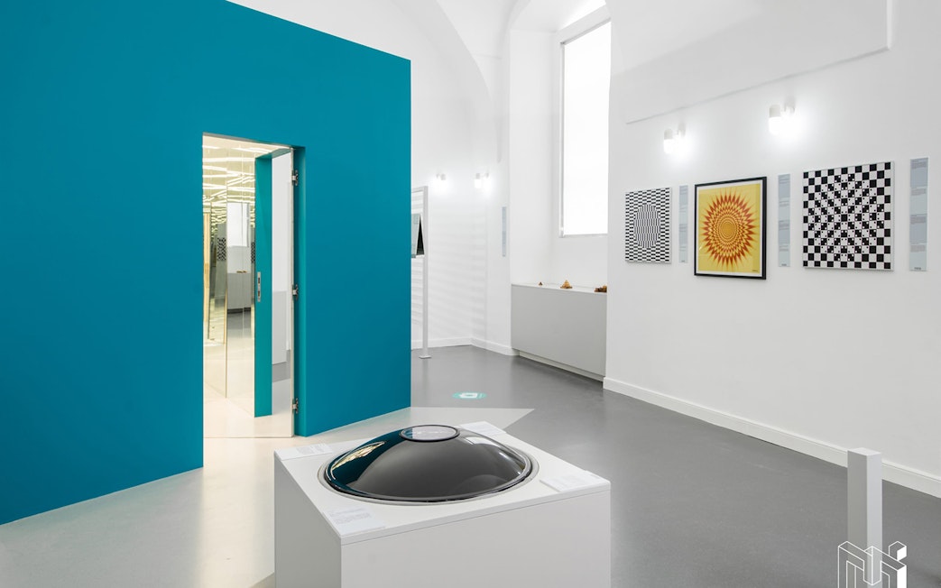 Exhibits at the Museum of Illusions in Vienna, Austria, featuring optical art and interactive displays.