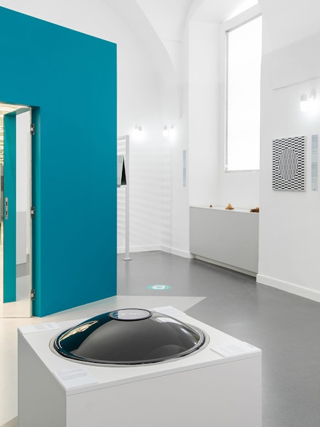 Exhibits at the Museum of Illusions in Vienna, Austria, featuring optical art and interactive displays.