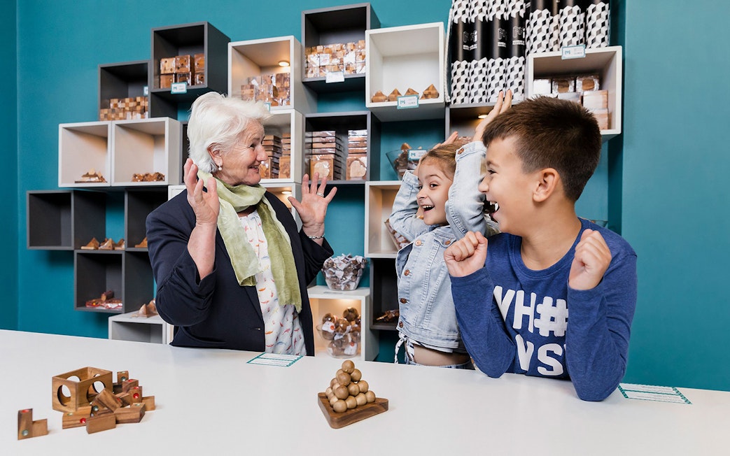 Visitors enjoying interactive exhibits at the Museum of Illusions in Vienna.
