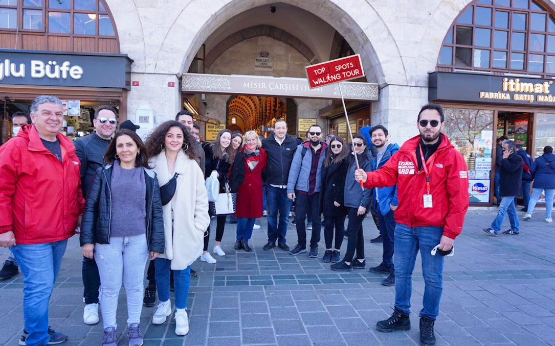 Group of tourists on a walking tour at the entrance of Istanbul's Spice Market.