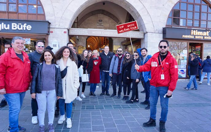 Group of tourists on a walking tour at the entrance of Istanbul's Spice Market.