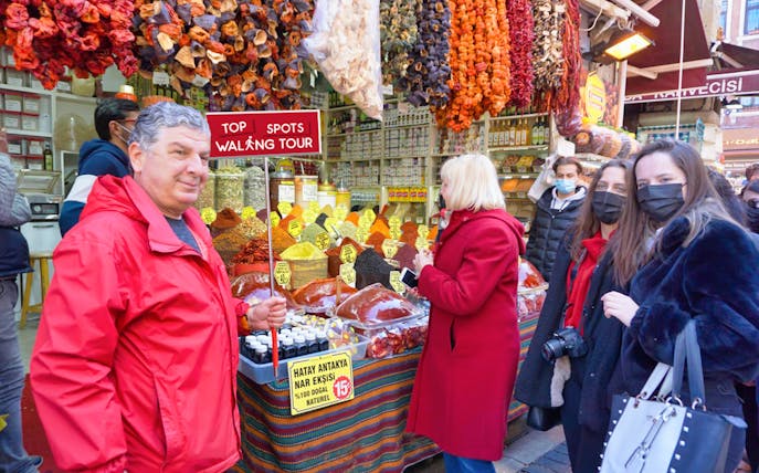 Tourists exploring a spice market on the Top Spots Walking Tour between Old City and Taksim.