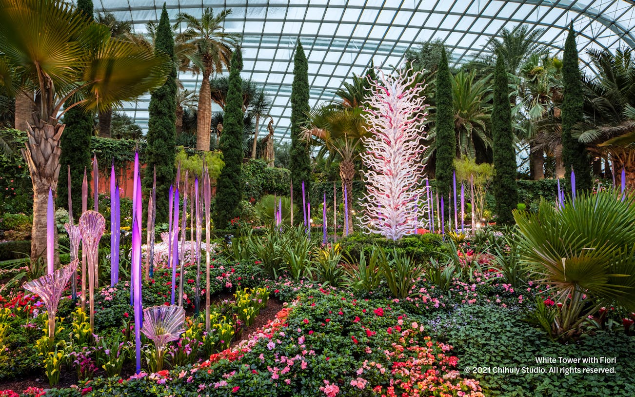 Chihuly glass sculptures in vibrant garden at Gardens by the Bay, Singapore.