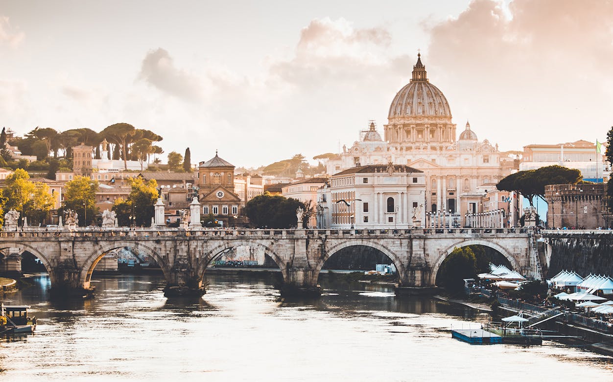 Castel Sant'Angelo and St. Peter's Basilica viewed from the Tiber River, Rome.