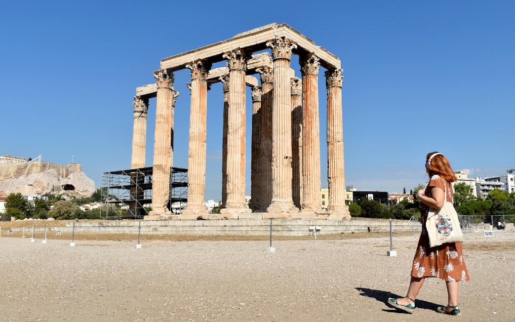 Temple of Olympian Zeus with visitor, Athens, Greece.