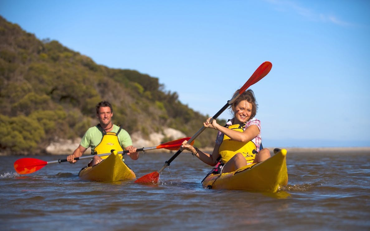 Kayakers paddling on Kangaroo Island guided tour.