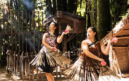 Tamaki Maori Village performers in traditional attire during cultural dance.