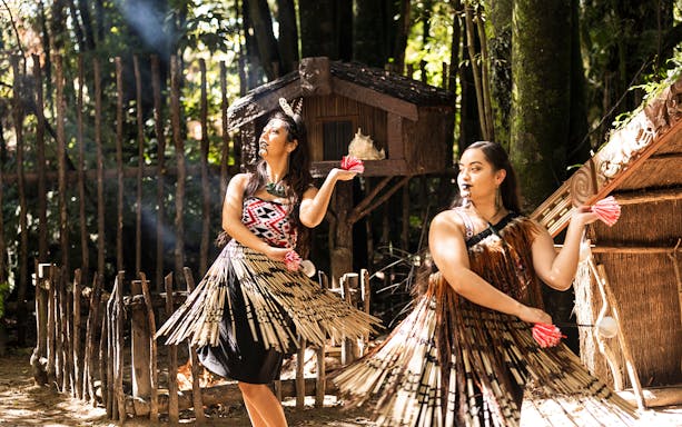 Tamaki Maori Village performers in traditional attire during cultural dance.