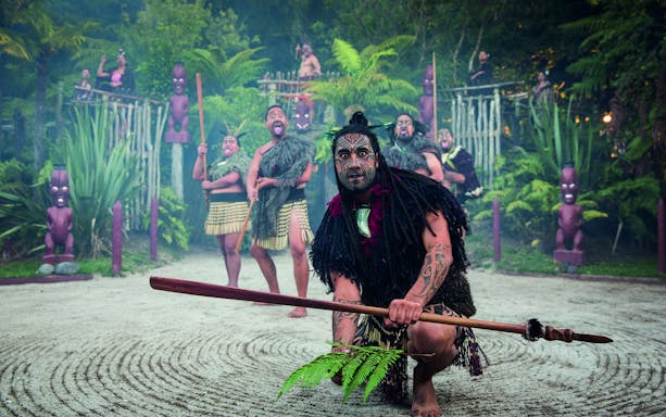 Tamaki Maori Village performers in traditional attire during cultural ceremony.