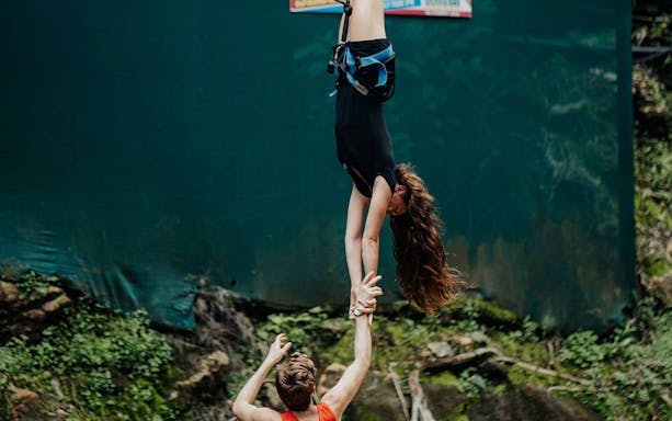 Bungee jumper suspended upside down at Skypark Cairns Adventure.