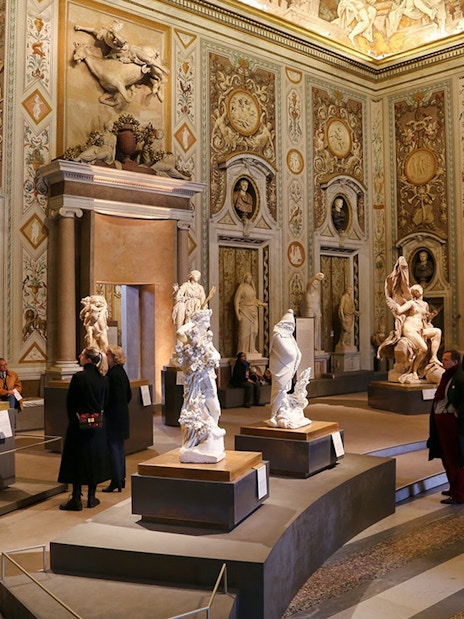 Borghese Gallery interior with sculptures and visitors, Rome.