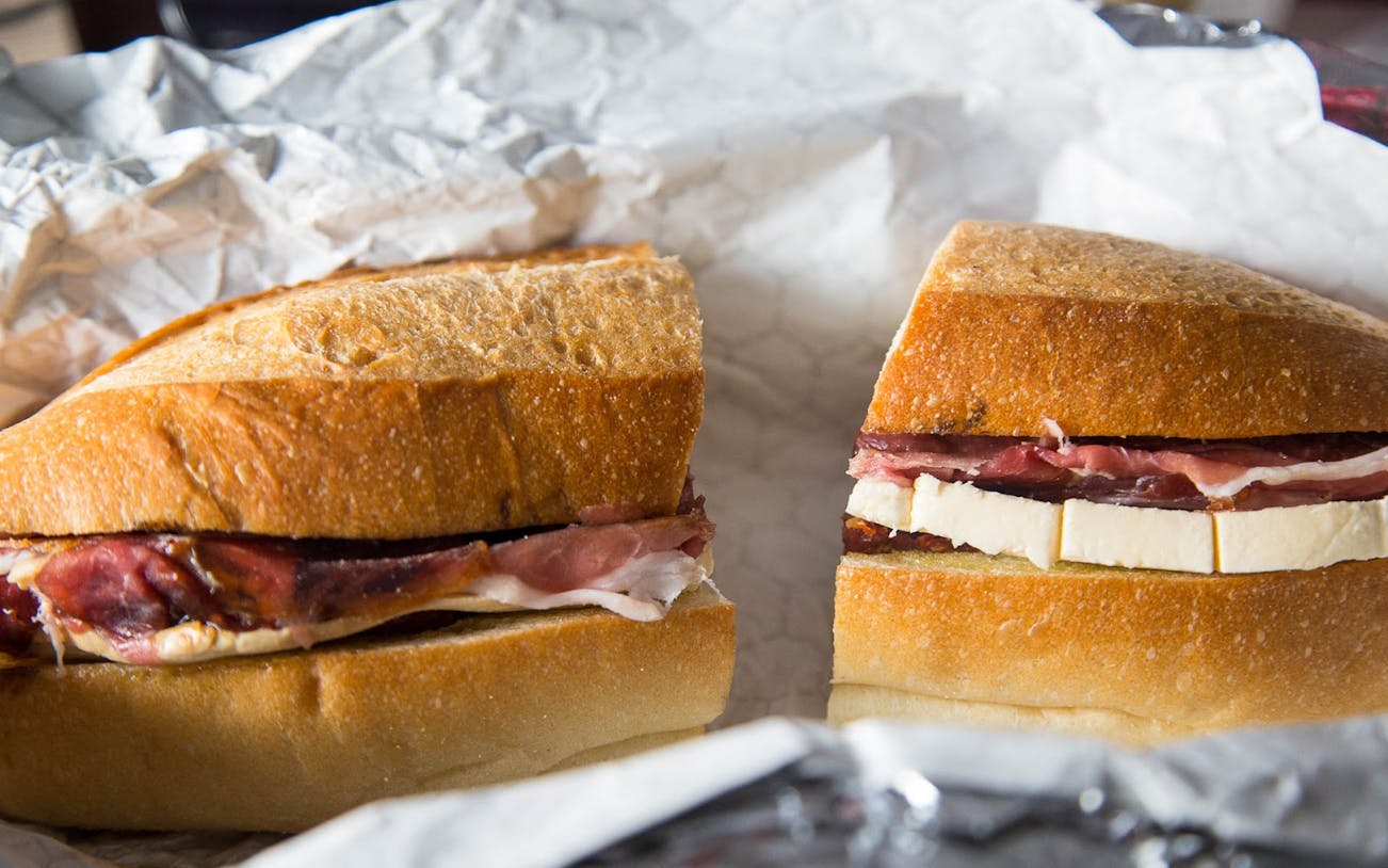 Sandwich with cured meat and cheese on the Chelsea Market Food and Culture Walking Tour.