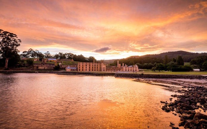 Port Arthur Historic Site at sunset, viewed from the water, Tasmania.