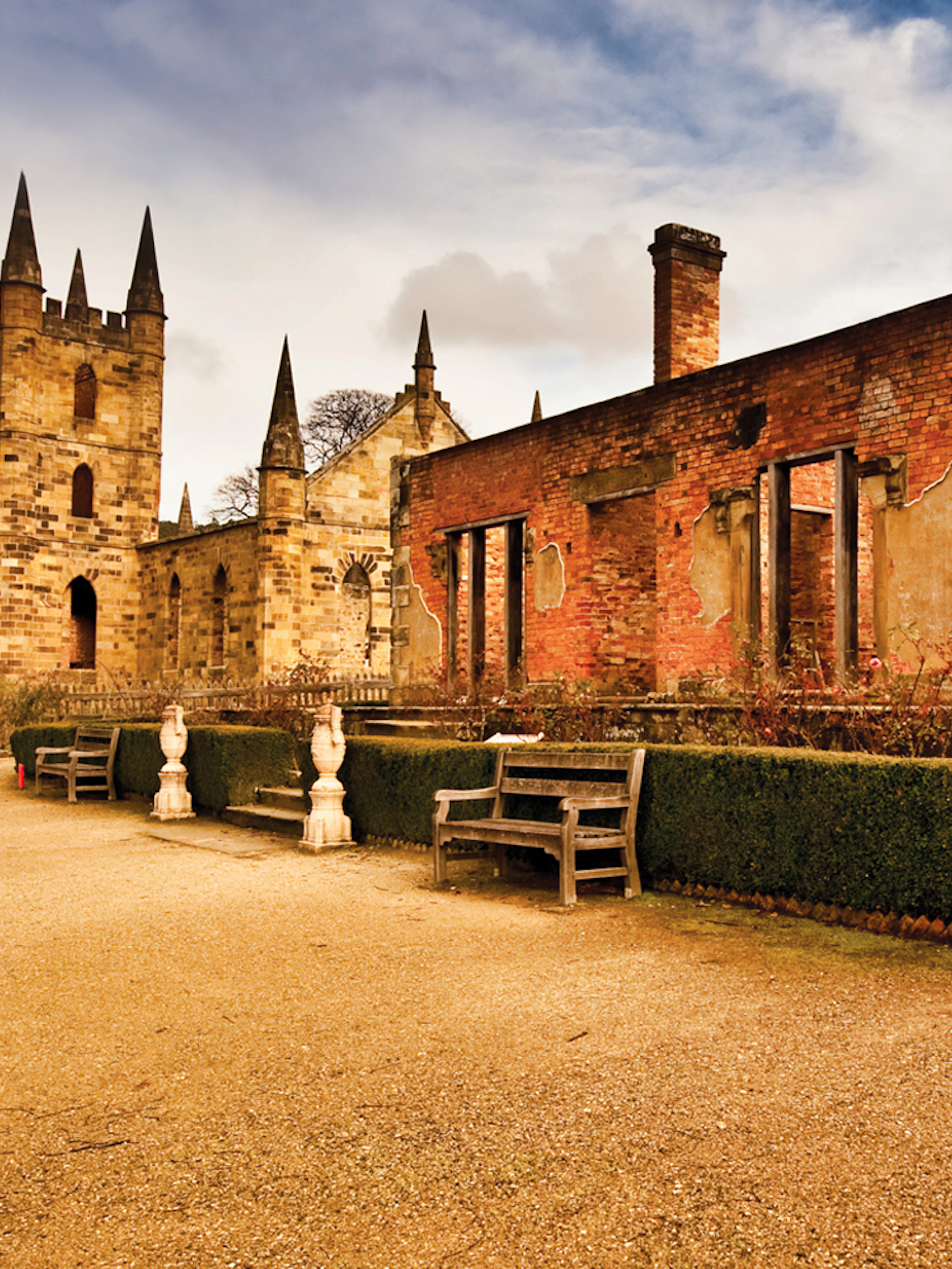 Port Arthur historic site with visitors exploring ruins, Hobart to Port Arthur bus service.