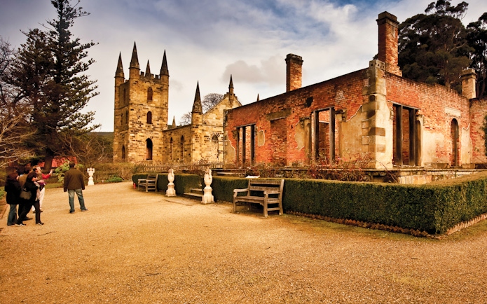 Port Arthur historic site with visitors exploring ruins, Hobart to Port Arthur bus service.