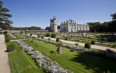 Chenonceau Castle with formal gardens in Loire Valley, France.