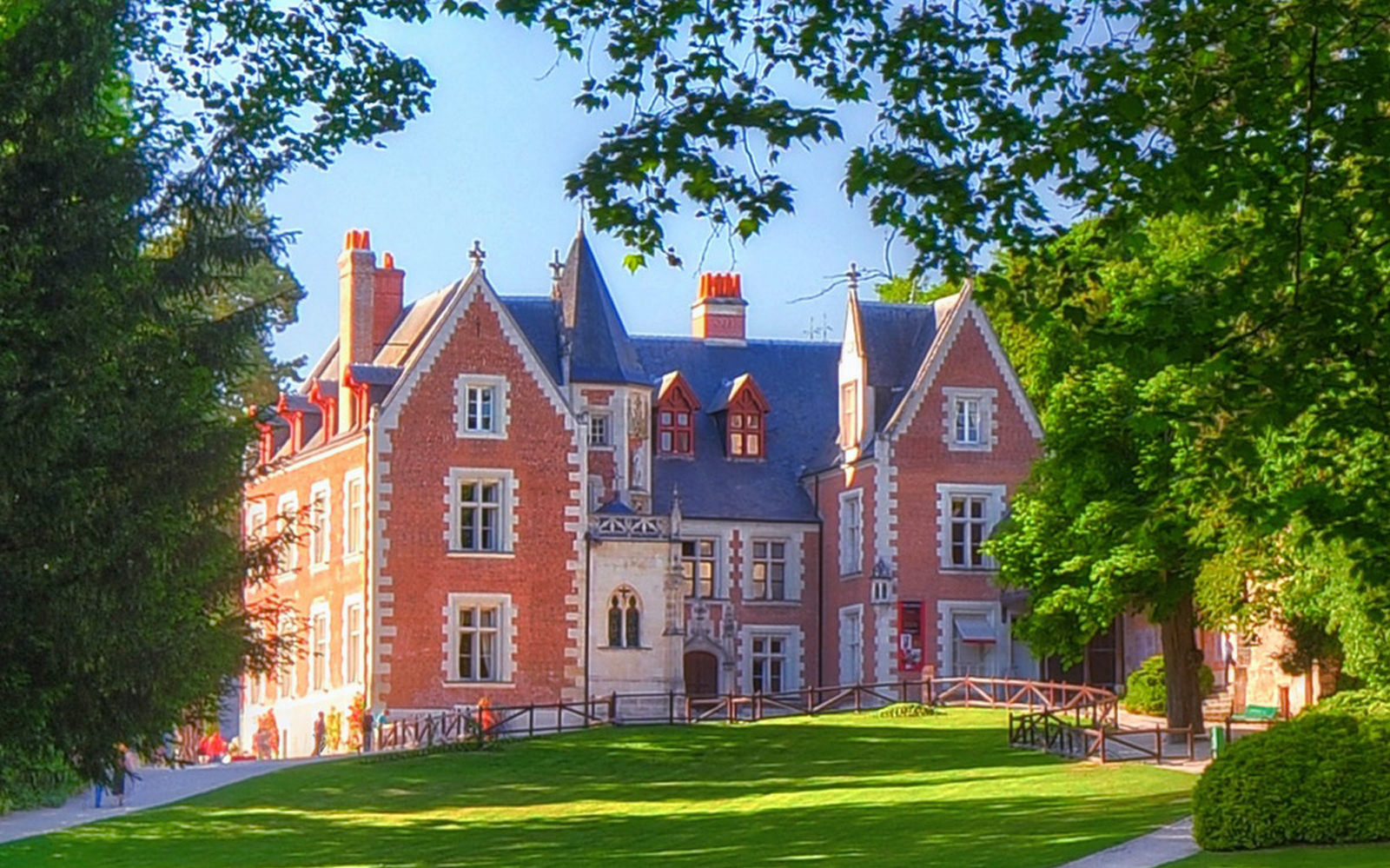 Clos Lucé Castle surrounded by lush greenery in Amboise, France.