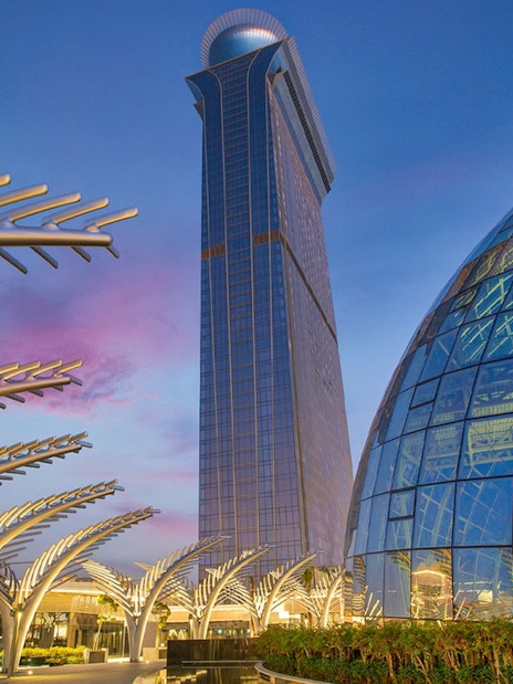 The View at the Palm observation deck and architectural structures at sunset in Dubai.