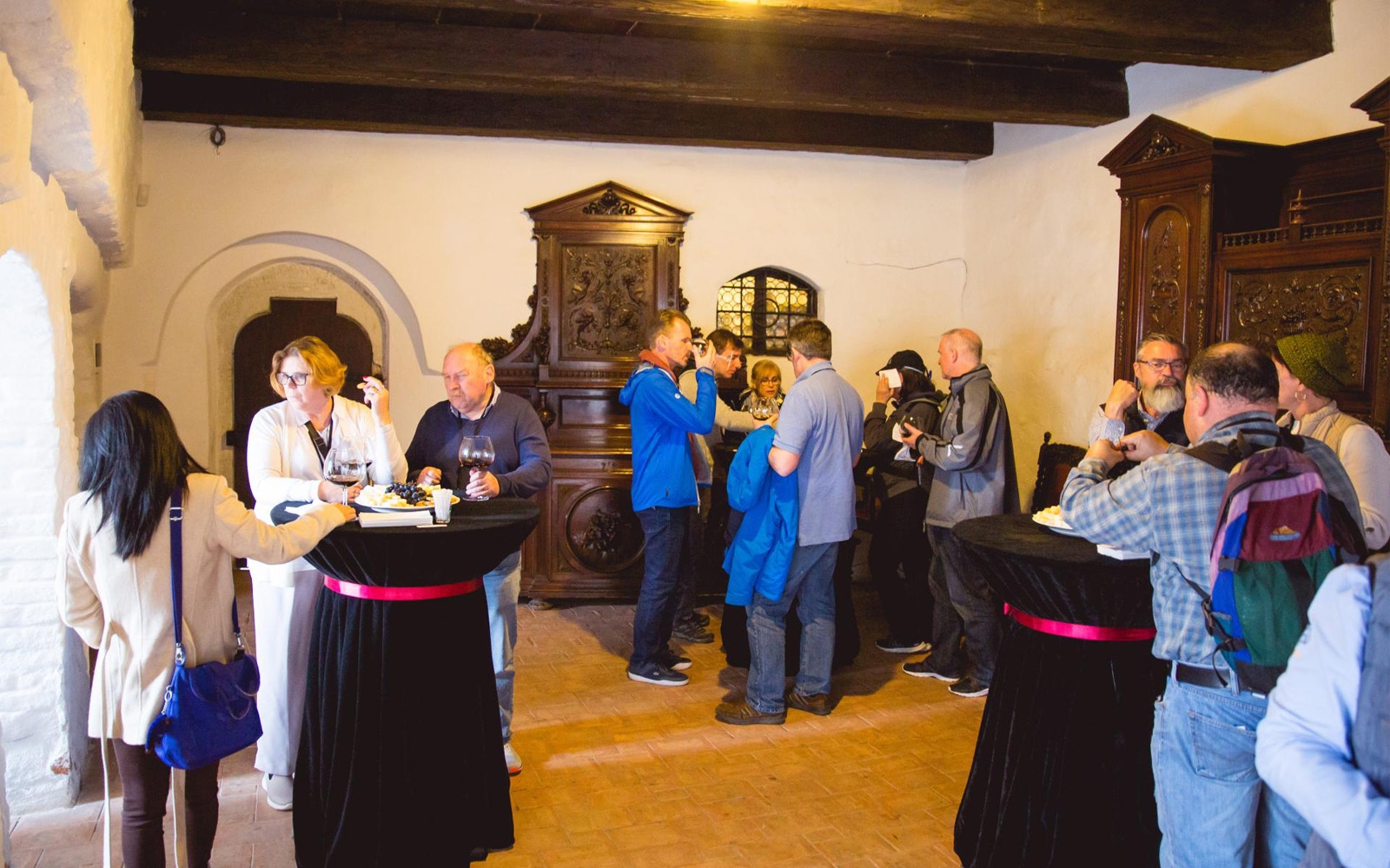 Visitors enjoying a wine tasting at Dracula's Castle in Brasov.