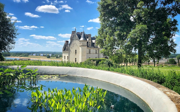 Chaumont sur Loire castle with garden pond and scenic landscape.