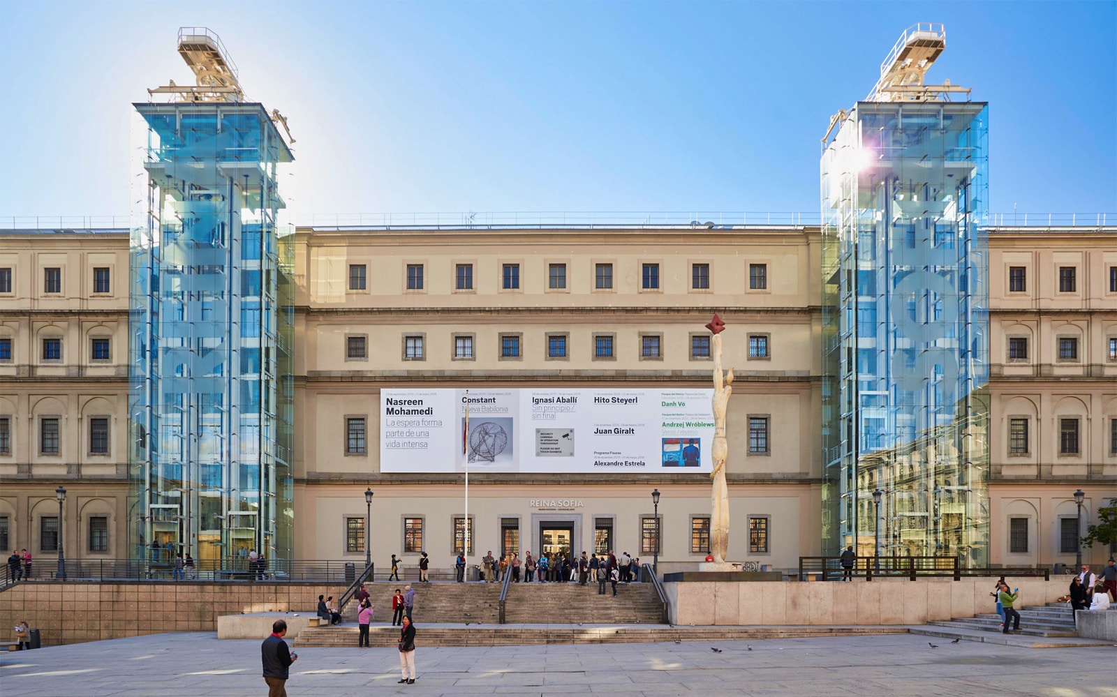 Reina Sofía Museum entrance with visitors in Madrid, Spain.