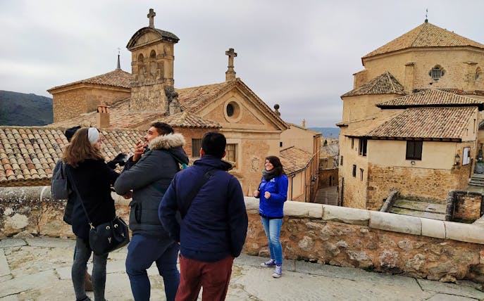 Tour group exploring historic architecture in Toledo, Spain.