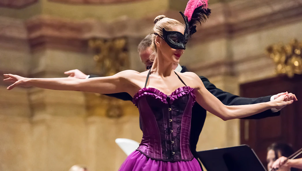 Dancer in a mask performing at Vienna Supreme Concerts.