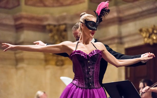 Dancer in a mask performing at Vienna Supreme Concerts.