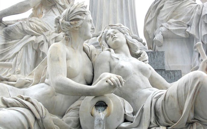 Marble statue of two intertwined figures with flowing water, Vienna.