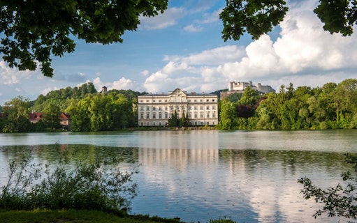 Schloss Leopoldskron by a lake in Salzburg, featured in The Sound of Music tour.