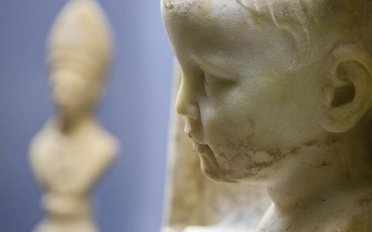 Marble busts inside the Apostolic Palace, highlighting intricate details.