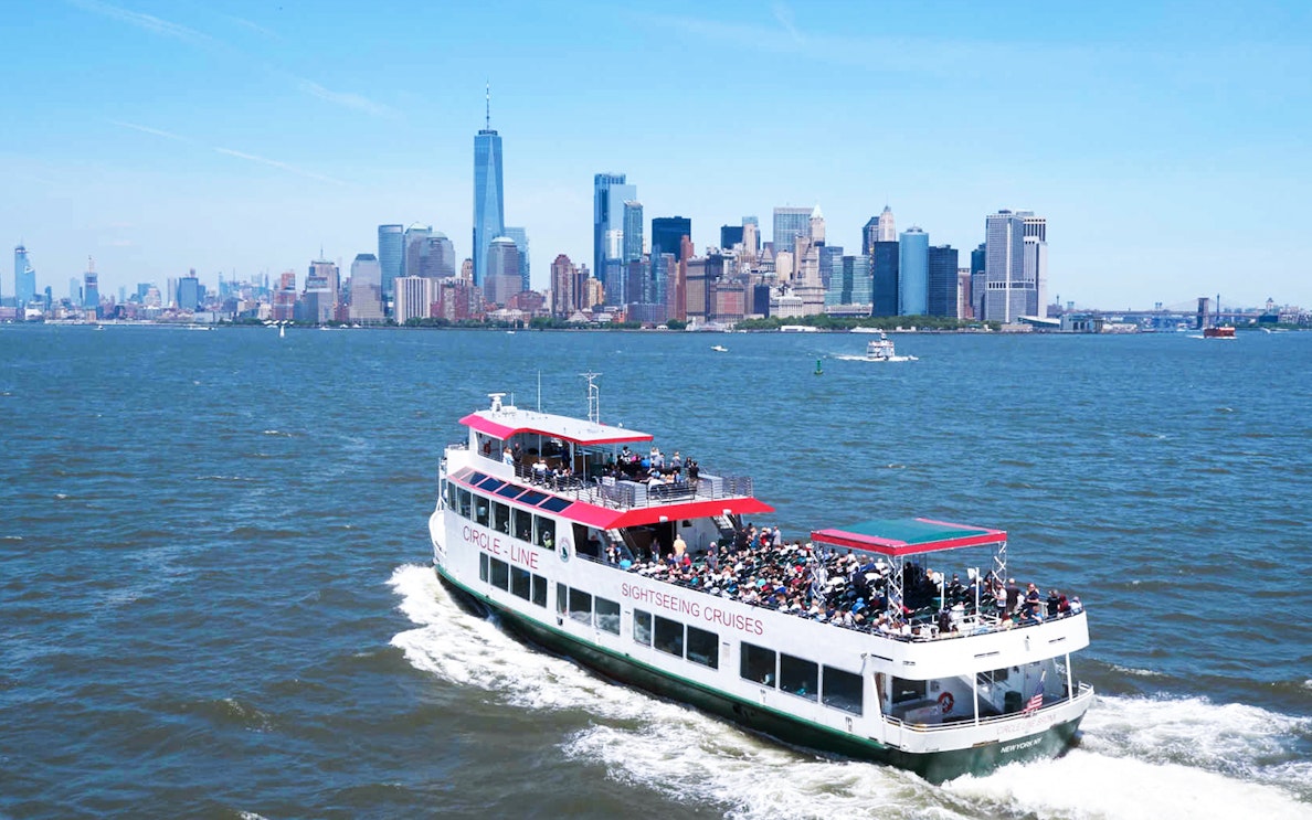 Sightseeing cruise near New York City skyline with One World Trade Center.