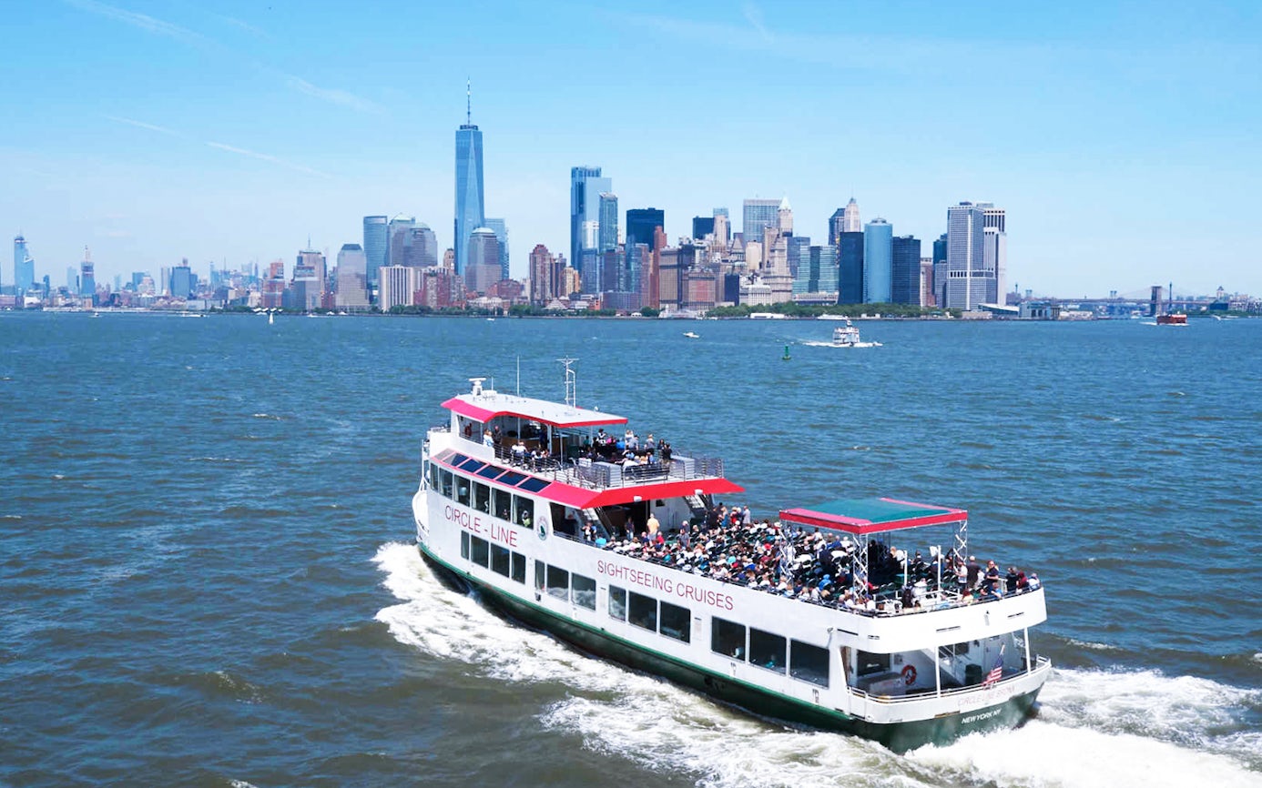 Sightseeing cruise near New York City skyline with One World Trade Center.