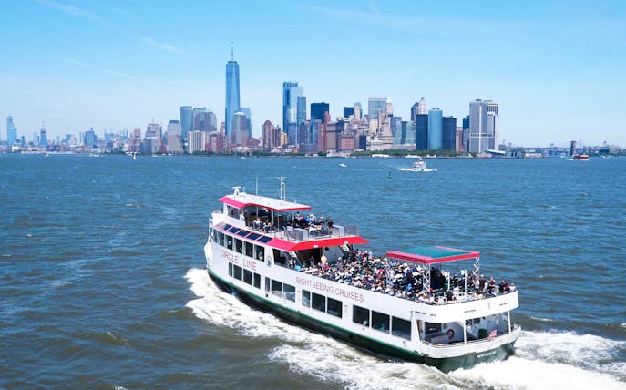 Sightseeing cruise near New York City skyline with One World Trade Center.