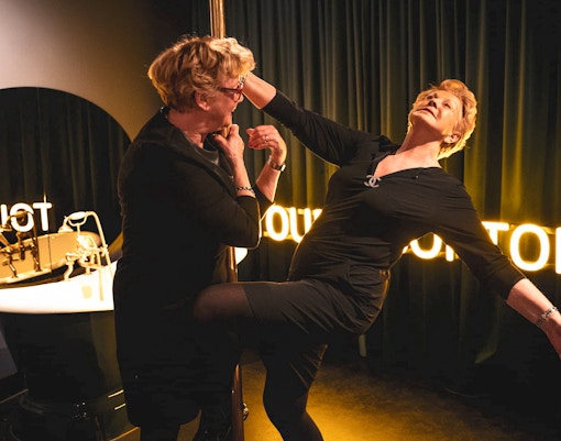 Visitors exploring the historic Tour de BonTon in Amsterdam.
