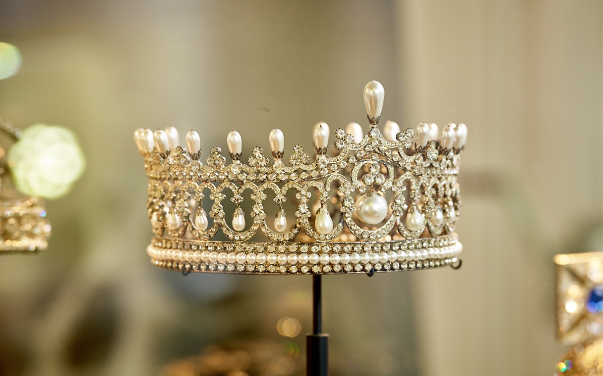 Ornate pearl and diamond crown on display at Diamond Museum Amsterdam.