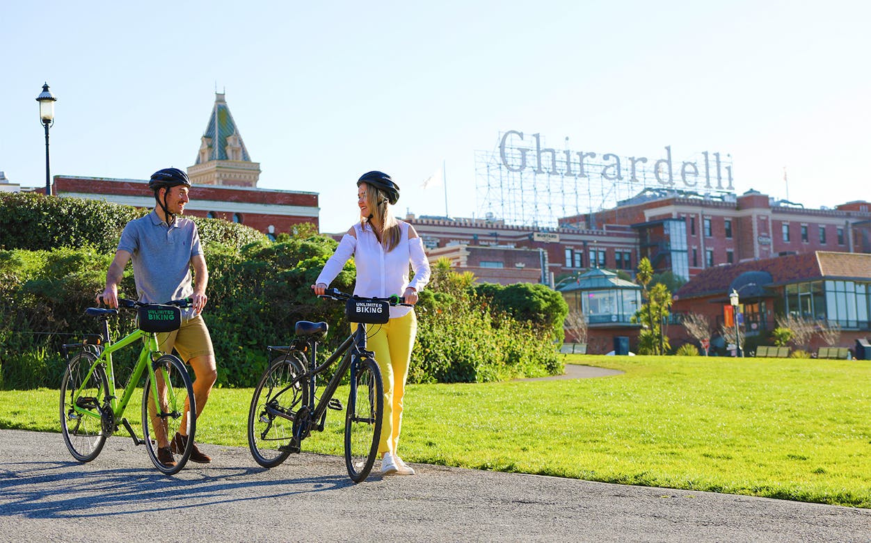 Cyclists with rented bikes near Ghirardelli Square, San Francisco.