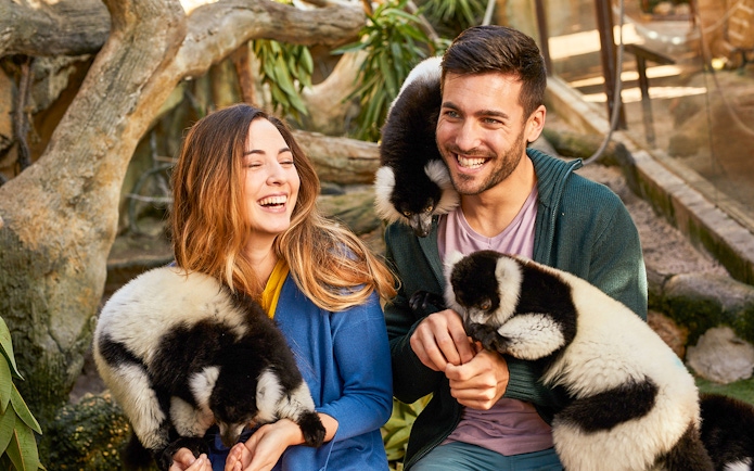 Visitors interacting with lemurs at Mundomar Marine Animal Park.