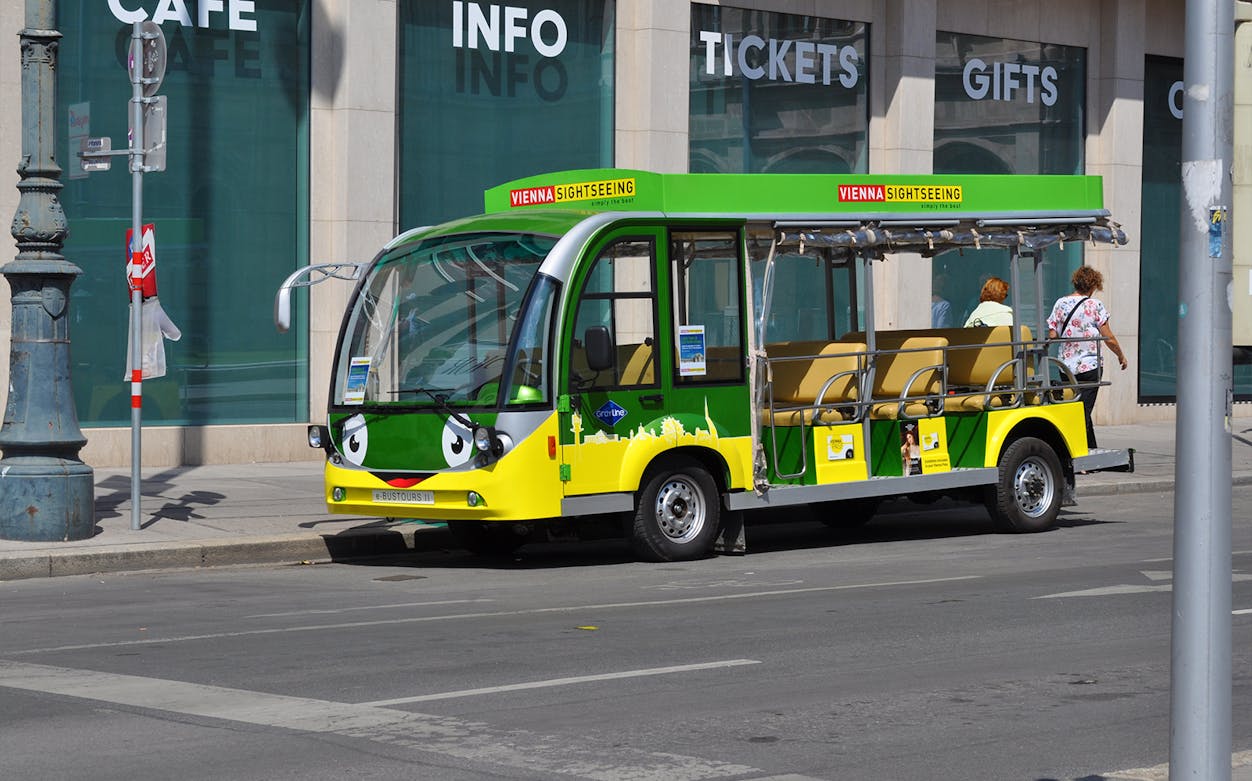 E-bus parked in Old Town Vienna for sightseeing tour.