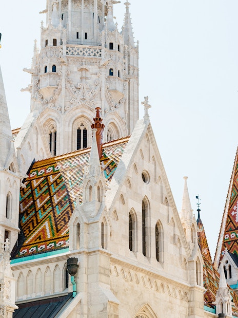 Matthias Church with colorful roof tiles in Budapest, seen on a day trip from Vienna.