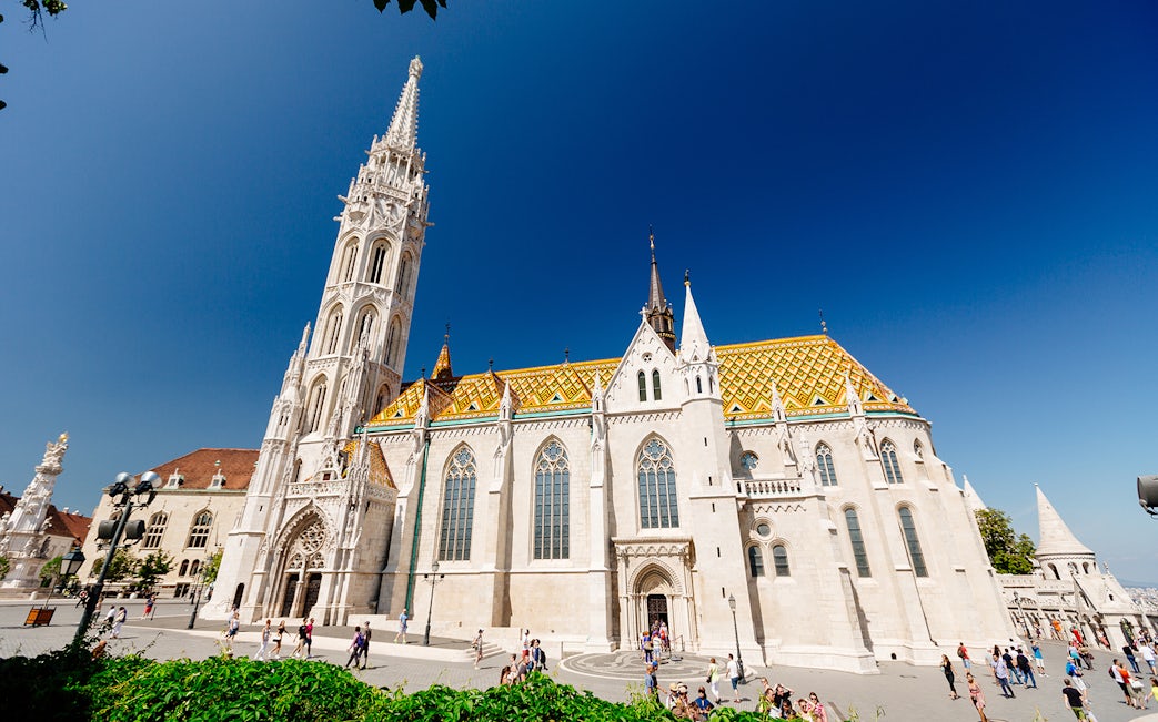 Matthias Church in Budapest with colorful roof and tall spire, seen on a day trip from Vienna.